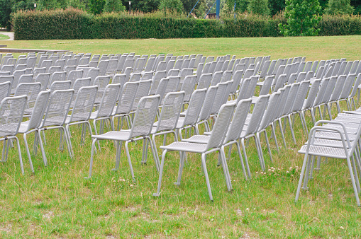 Empty metal chairs before outdoor event