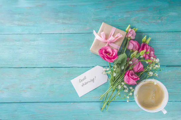 Photo of Coffee with flowers and notes good morning