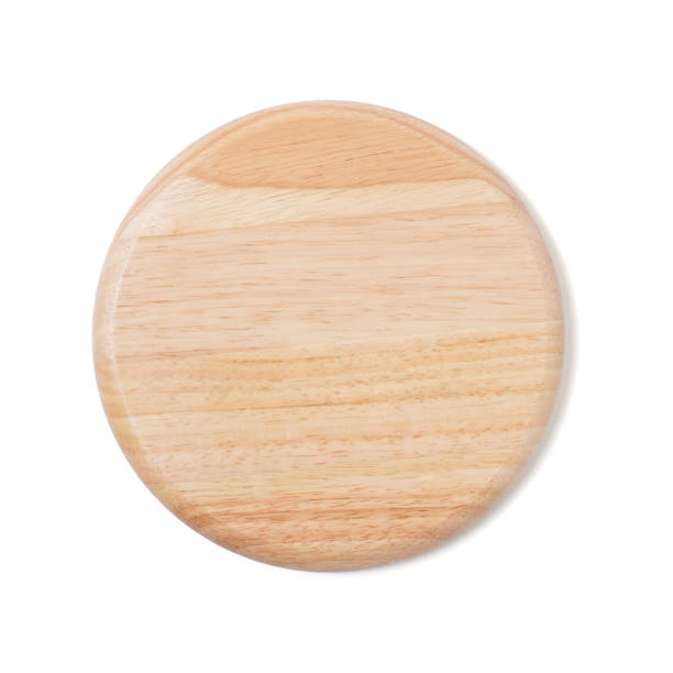 istock Brown round woodcutting board isolated on white background 1297032816