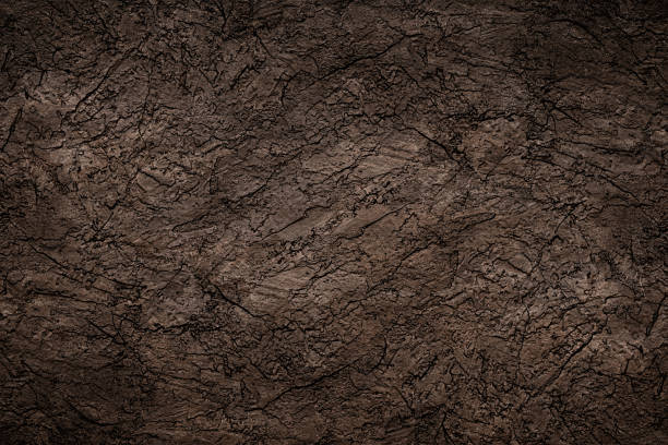 istock Black stone background texture. Black stone plaster cement. Grunge wall. Graphite 1297032953