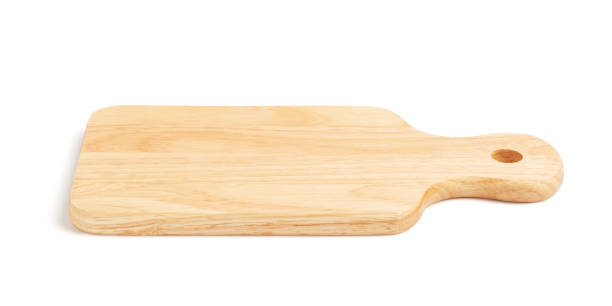 istock Brown wood cutting board with handle and drill hole for hanging isolated 1297032959