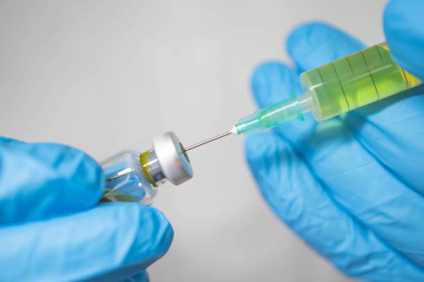 istock Preparing injection with covid-19 vaccine 1297033163
