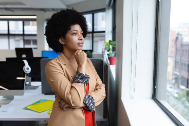 istock Mixed race businesswoman working in creative office 1297033693