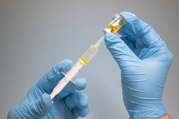 istock Preparing injection with covid-19 vaccine 1297033753