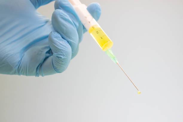pipette with a drop of cosmetic product