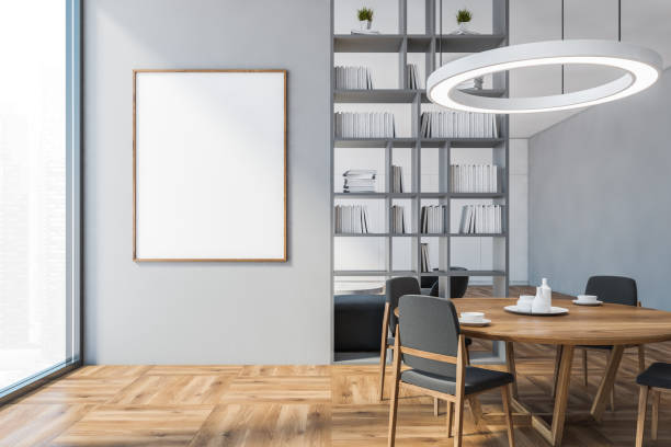 istock Mockup frame with grey chairs and table, bookshelf with big window 1297034046
