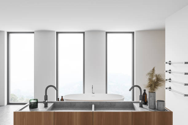 istock Modern white bathroom interior with tub and sink 1297034152