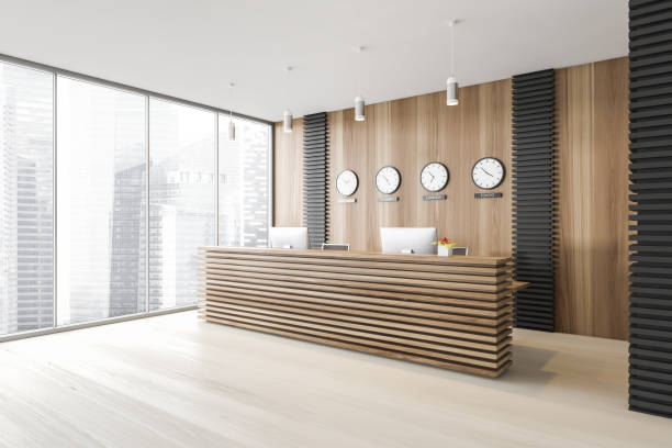 istock Panoramic gray office waiting room conrer with reception and clocks 1297034290