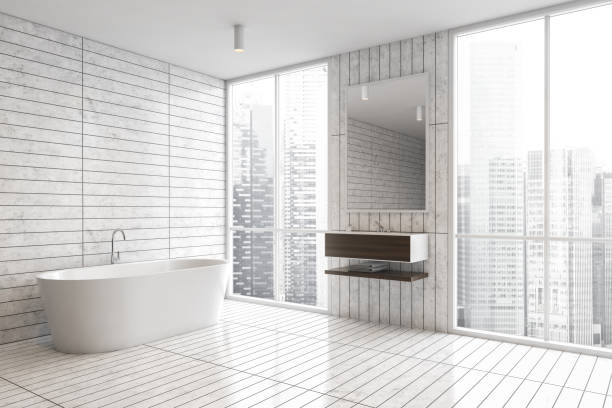 istock White tile bathroom corner with tub and sink 1297035260