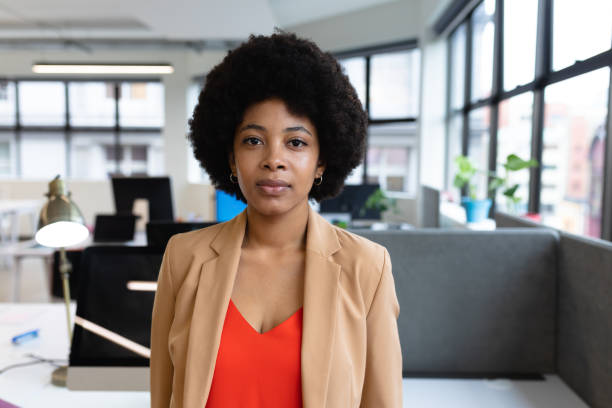 istock Mixed race businesswoman working in creative office 1297036574