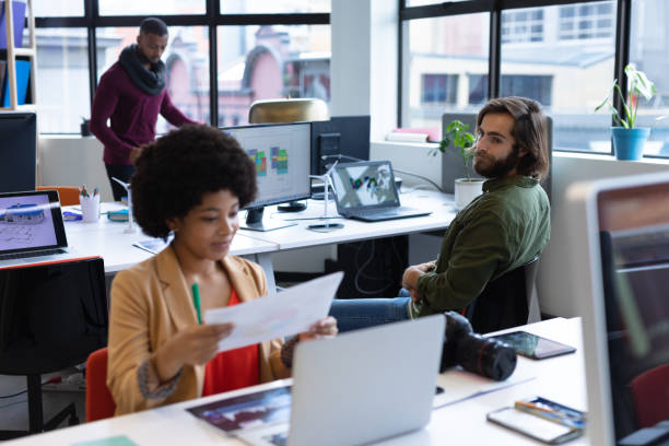 istock Mixed race businesswoman working in creative office 1297038420
