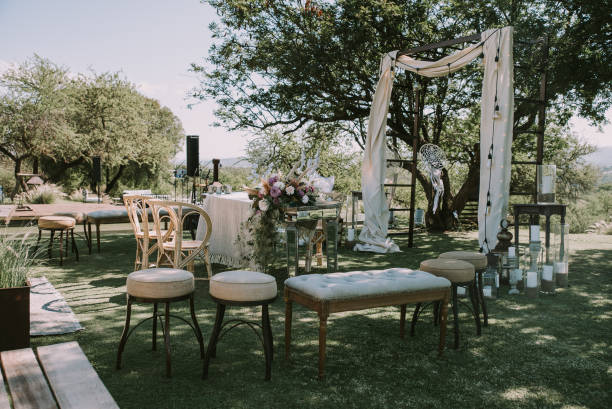 istock Table with white tablecloth, wooden plates and candles 1297039436