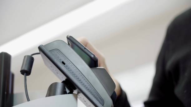 istock Pay for goods through the terminal in a contactless way in a supermarket. Using Modern and Convenient Wireless 1297039530
