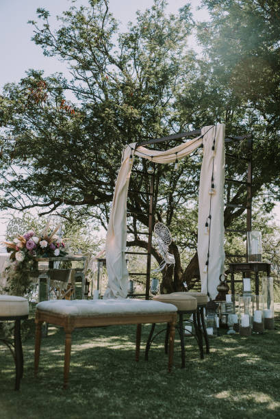 istock Table with white tablecloth, wooden plates and candles 1297039561