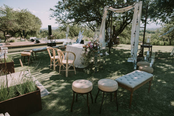 istock Table with white tablecloth, wooden plates and candles 1297039594