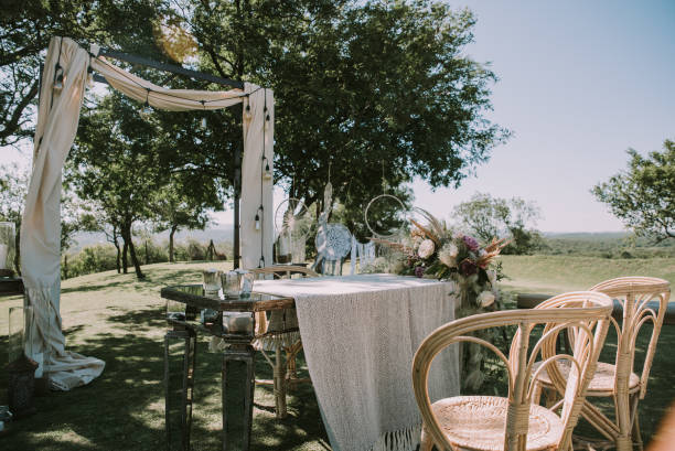 istock Table with white tablecloth, wooden plates and candles 1297039596