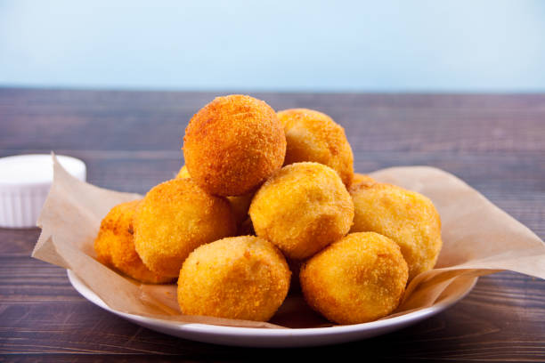 istock Potato croquettes balls on the plate and dips sauces 1297039686