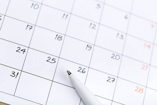 istock white calendar page for 2021 month schedule to make an appointment or manage the schedule every day with ballpoint pen for marks, for work planning and life concept 1297043592
