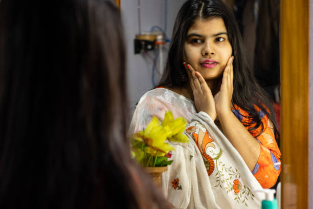 istock indian woman in front of mirror 1297044550