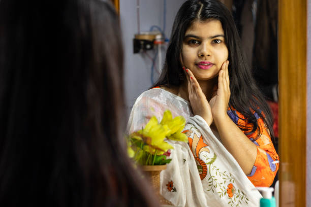 istock indian woman in front of mirror 1297044557