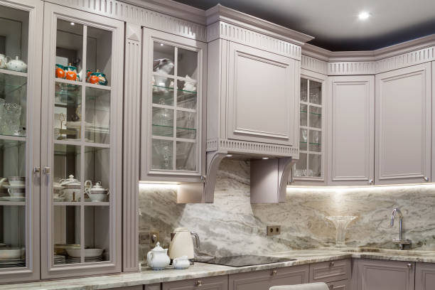 istock Modern beige and grey colored kitchen interior classic style with marble countertop in luxury apartment 1297044672