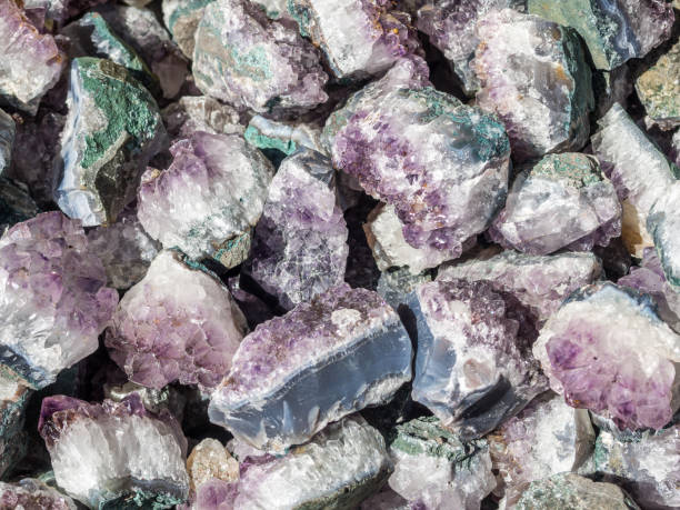 istock Crystal Stone macro mineral, purple rough amethyst quartz crystals 1297046251