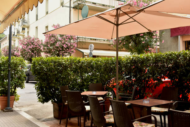 istock Pretty deserted cafe table and chairs 1297047248