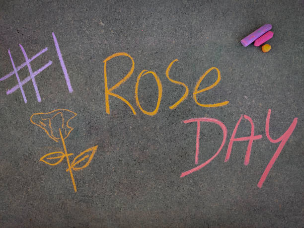istock The inscription text on the grey board, #1 Rose day with hand drawn rose . Using color chalk pieces. Valentines week 1297047299