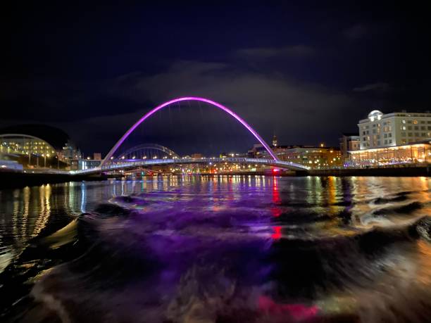 istock Millenium Bridge at night by boat on the river 1297048476