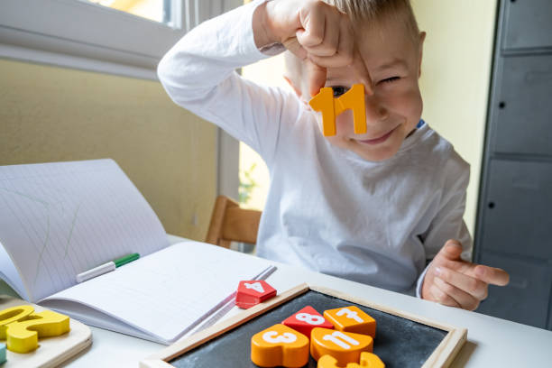 istock Playful Little Boy learning Numbers and mathematics basics, Homeschooling 1297051270