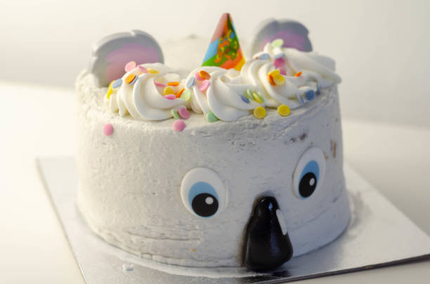 istock Madeira sponge layered with frosting and raspberry jam, covered in soft icing with edible decorations, koala bear-shaped cake, 1297052891