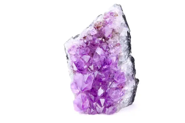 Purple amethyst isolated on a white background. Lilac Mineral amethyst. Violet Crystal stone.