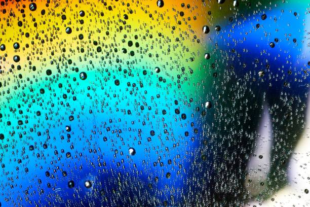 istock Macro of water drops on multicolor background 1297058853