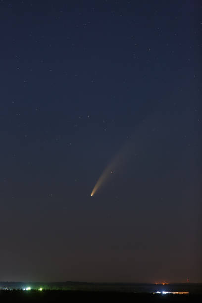 istock Comet C / 2020 F3 (NEOWISE) in the night starry sky. 1297061242