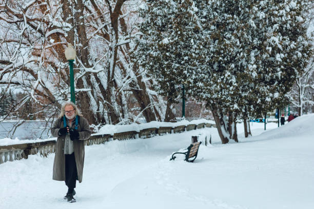 istock With the COVID lockdown still going on, before the 8 PM to 5 AM curfew, a man is walking in a park. 1297062529