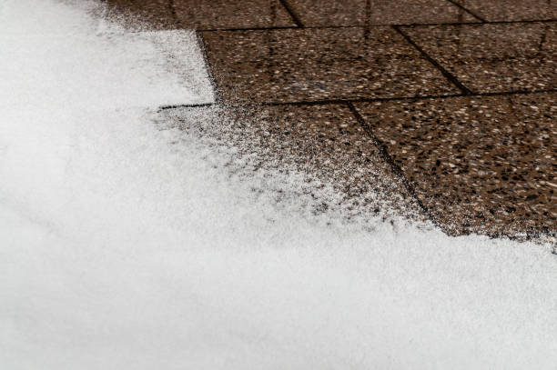 istock background with street tiles partially covered with snow 1297062869