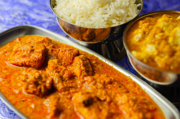 istock Mild chicken Korma and chicken Tikka Masala with Basmati rice 1297064343
