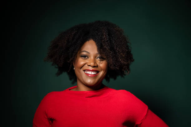 istock Confident african woman on green background 1297067364