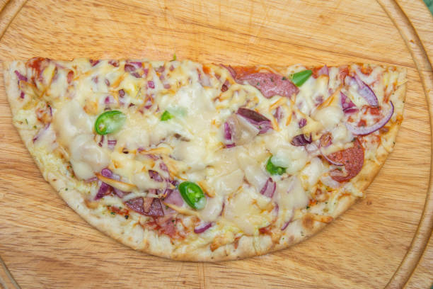 istock homemade pizza on a wooden plate 1297069031