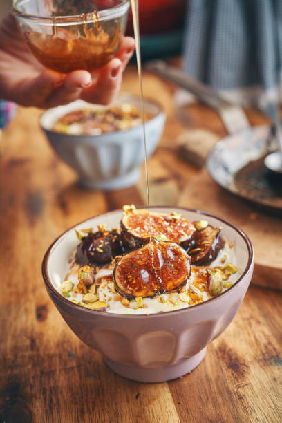 istock Healthy Yogurt with Caramelized Figs, Honey and Pistachio 1297069755