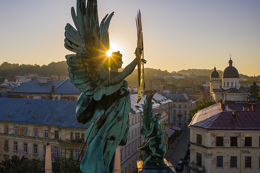 Lviv, Ukarine - August 24, 2020: Sculpture of fame with palm branch on Lviv opera house, Ukraine from drone