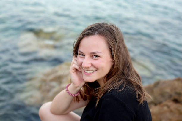 istock Beautiful young lady on the beach, summer 1297071905