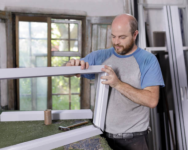 istock male carpenter in an aluminium carpentry workshop assembling the frame of a modena aluminum window 1297074937