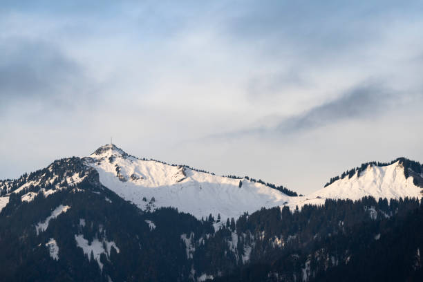ski area at the reuttener hahnenkamm in winter with gentle clouds in winter - hahnenkamm imagens e fotografias de stock