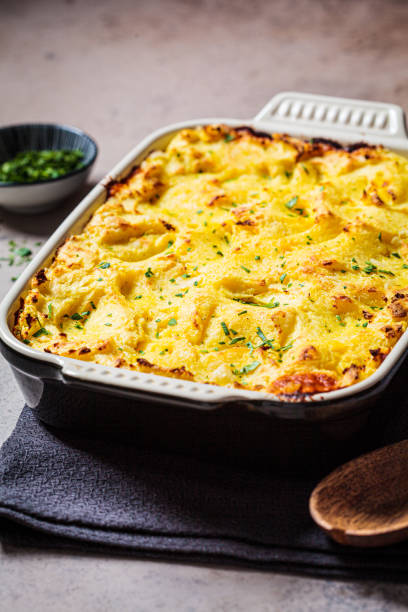 istock Traditional shepherd's pie with meat and mashed potatoes in black backing dish. Comfort food concept. 1297078477