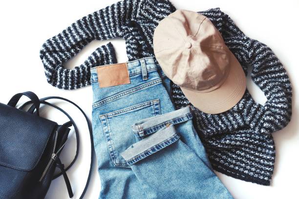 istock View from above woolen sweater, trendy blue jeans, beige cap and stylish backpack. Flat lay fashion lifestyle photography 1297080213
