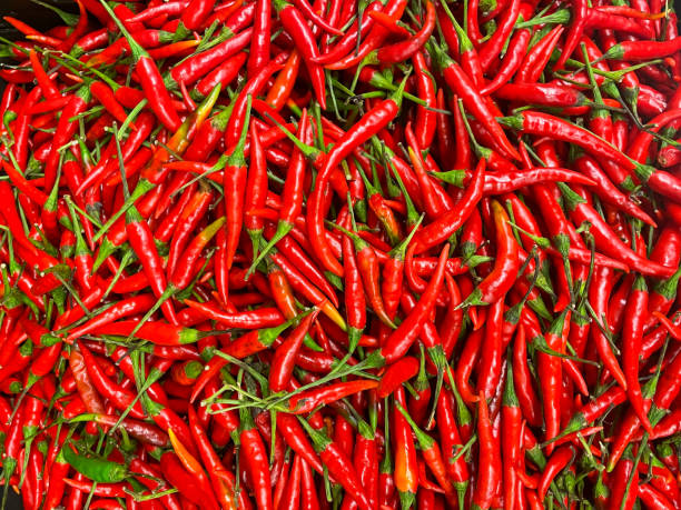 istock bunch of red hot chili peppers, full frame 1297080666