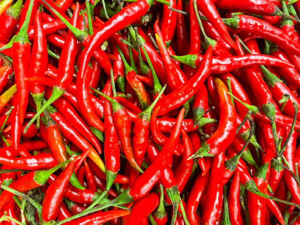 istock bunch of red hot chili peppers, full frame 1297080734