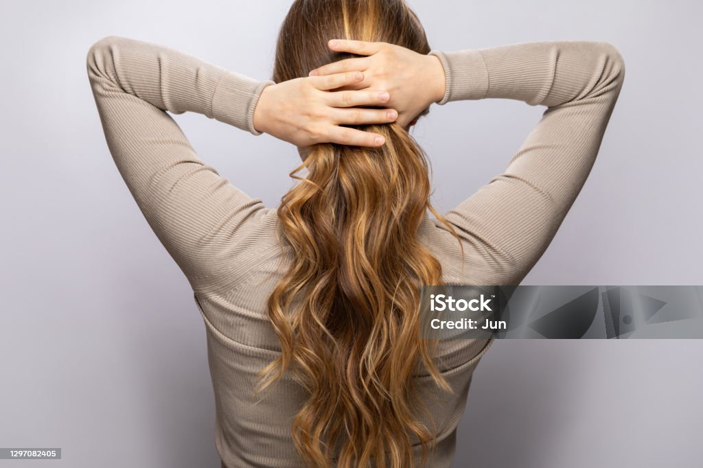 Young Woman Showing Her Beautiful Hair After Dyeing And Styling Stock Photo  - Download Image Now - iStock