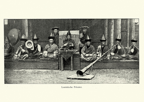 Vintage photograph of Lamist priests, playing horns, 19th Century. Tibetan Lamist Buddhism